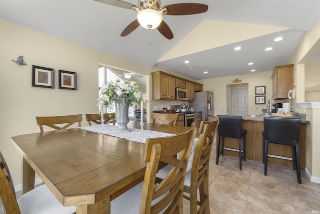 dining room with recessed lighting and vaulted ceiling