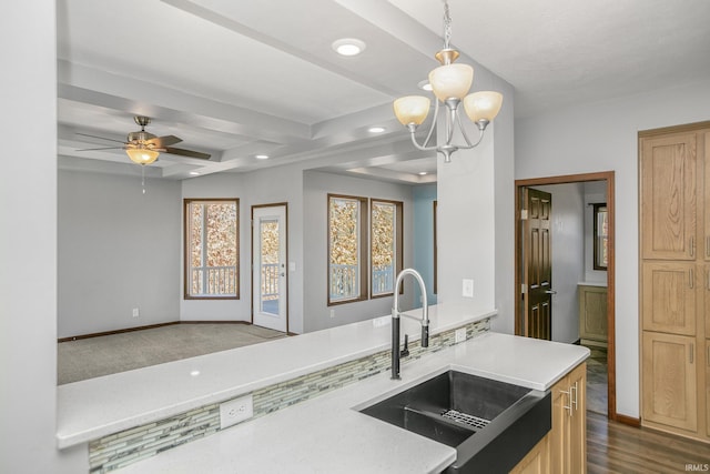 kitchen featuring baseboards, light countertops, recessed lighting, dark wood-style floors, and a sink