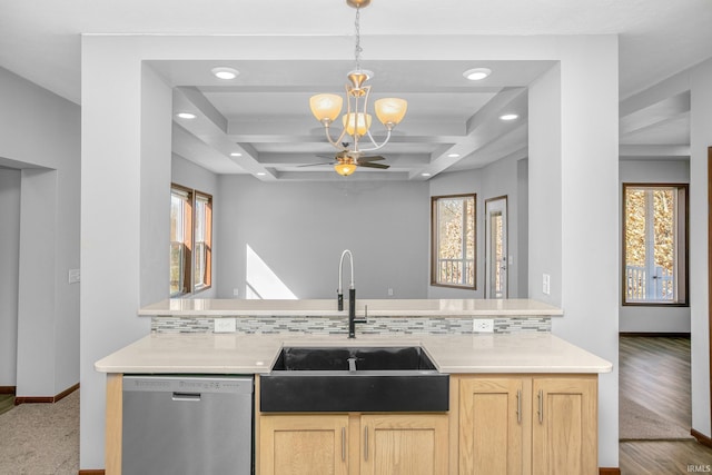 kitchen with dishwasher, plenty of natural light, light brown cabinetry, and a sink