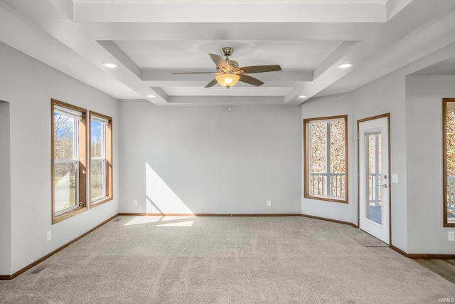 carpeted empty room with a tray ceiling, recessed lighting, and baseboards