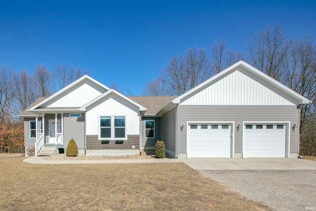 view of front of property with an attached garage, a shingled roof, and driveway