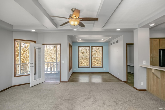 unfurnished living room with visible vents, recessed lighting, baseboards, and carpet floors