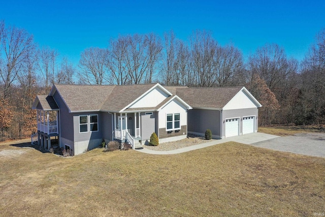 ranch-style house with a garage, driveway, roof with shingles, and a front lawn