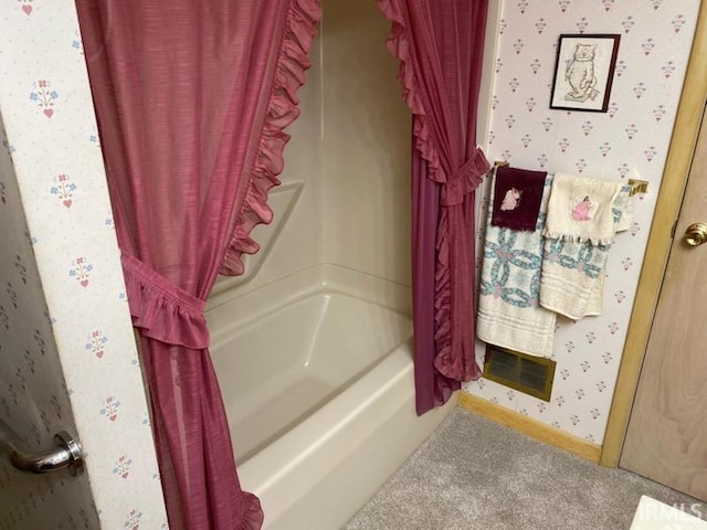 full bath with wallpapered walls, baseboards, and shower / tub combo with curtain