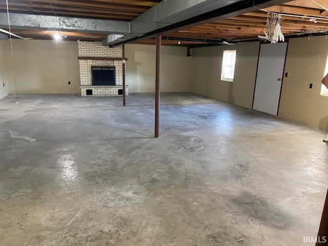 basement with a fireplace