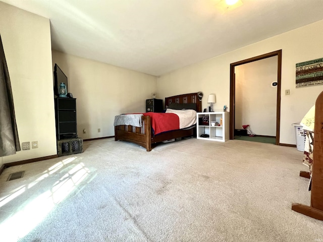 bedroom with visible vents, baseboards, and carpet