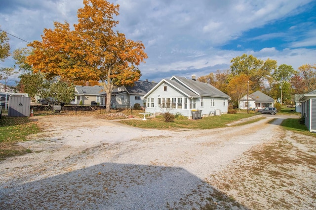 exterior space with dirt driveway