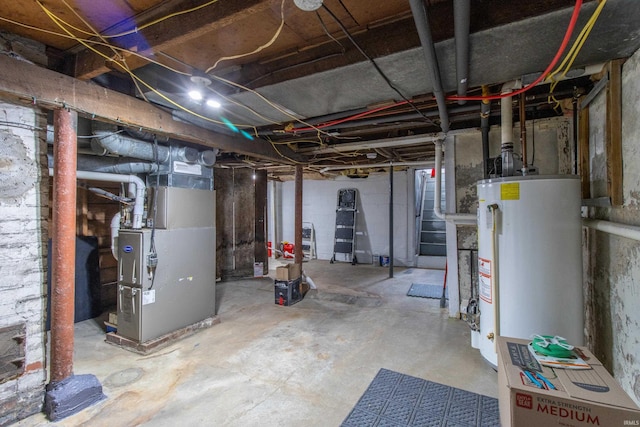 unfinished below grade area featuring gas water heater and heating unit