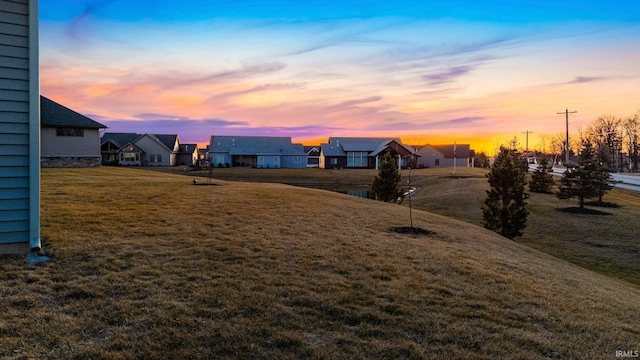 yard at dusk with a residential view