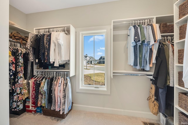 spacious closet with visible vents and carpet