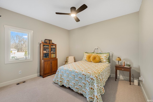 bedroom featuring visible vents, baseboards, carpet, and ceiling fan