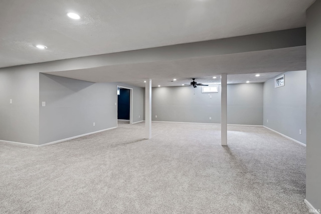 finished basement with recessed lighting, baseboards, and light carpet