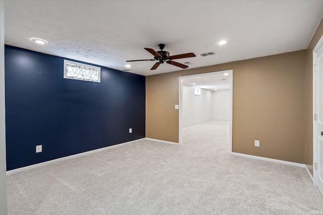 below grade area with visible vents, baseboards, and carpet