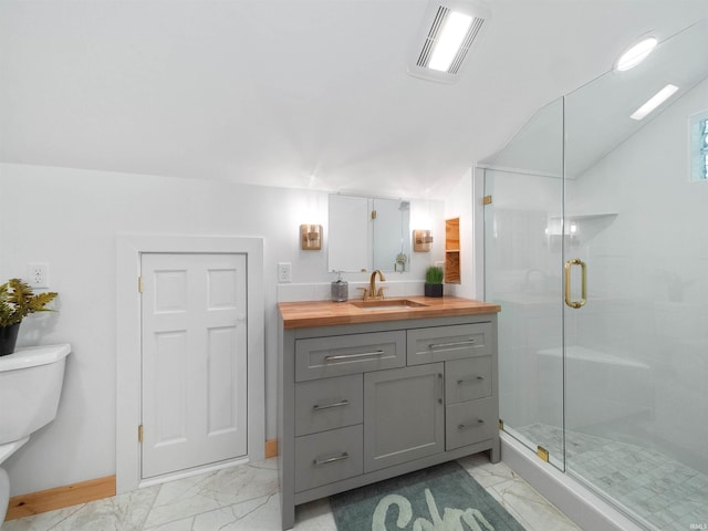 full bathroom featuring toilet, visible vents, marble finish floor, and a stall shower