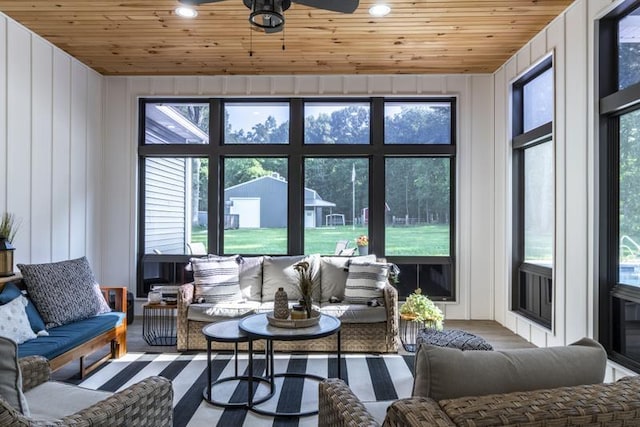 sunroom / solarium with wooden ceiling and a ceiling fan