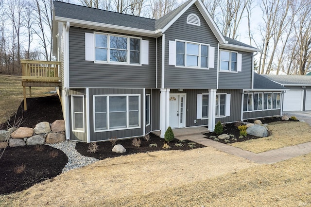 view of front of home featuring roof with shingles