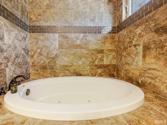 bathroom with a whirlpool tub