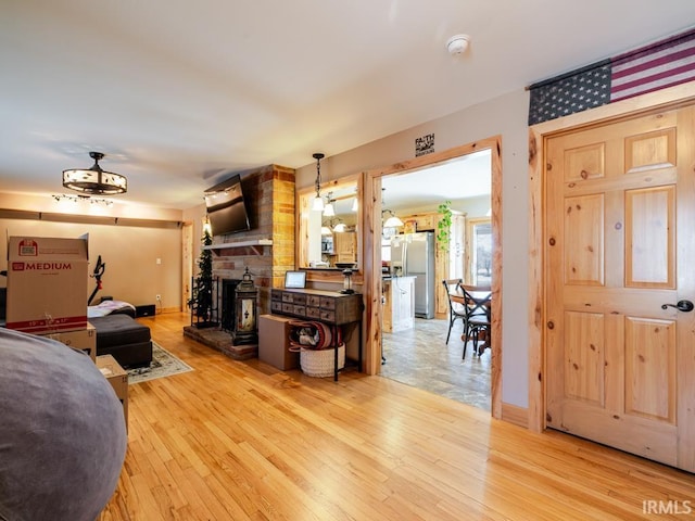 living room featuring baseboards and light wood-style floors