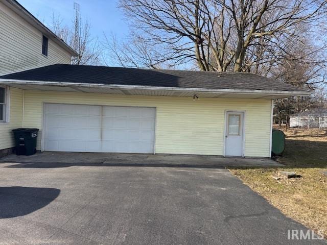 garage with aphalt driveway