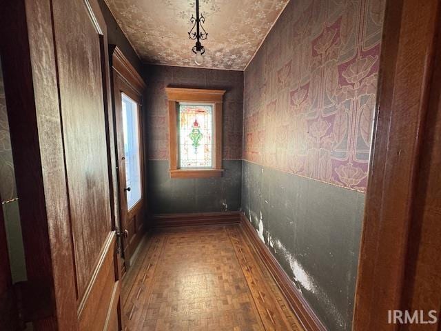 hall with wood finished floors
