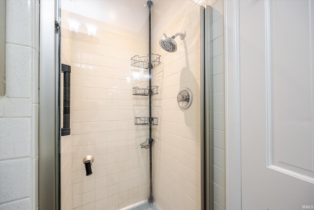 full bath featuring a shower stall