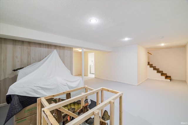 interior space with recessed lighting and stairs