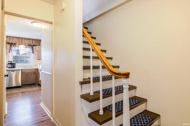 staircase with wood finished floors