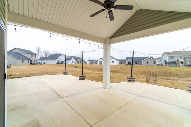 view of patio / terrace featuring a residential view and a ceiling fan