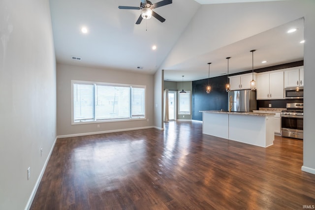 kitchen with stainless steel appliances, visible vents, open floor plan, and dark wood-style floors