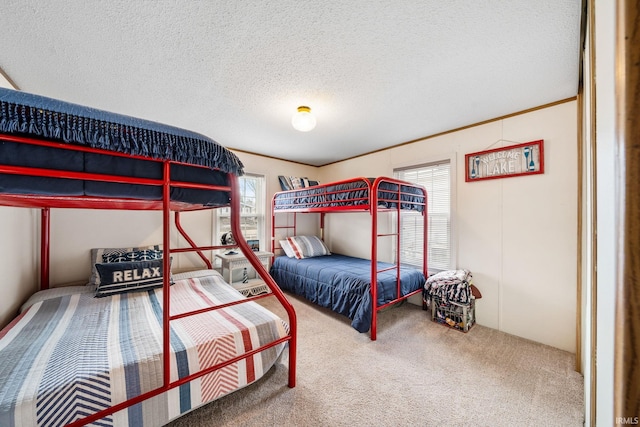 bedroom featuring carpet and a textured ceiling