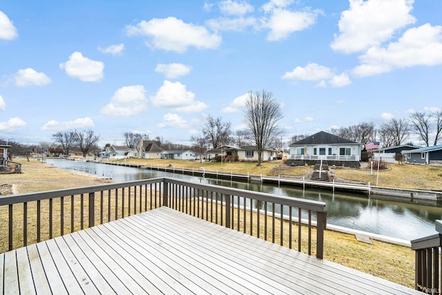 deck with a residential view and a water view