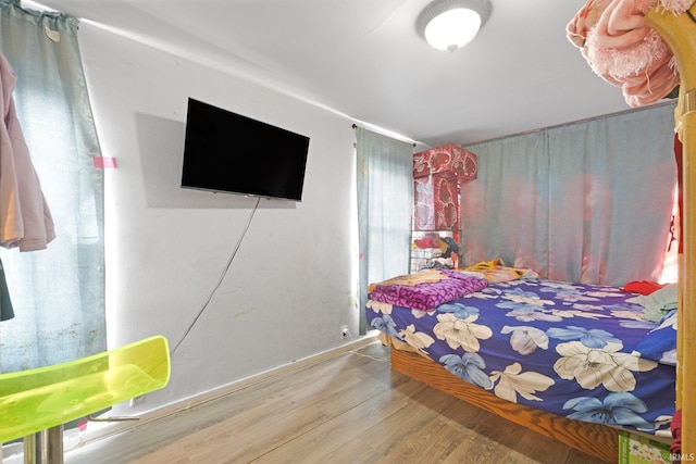 bedroom featuring wood finished floors