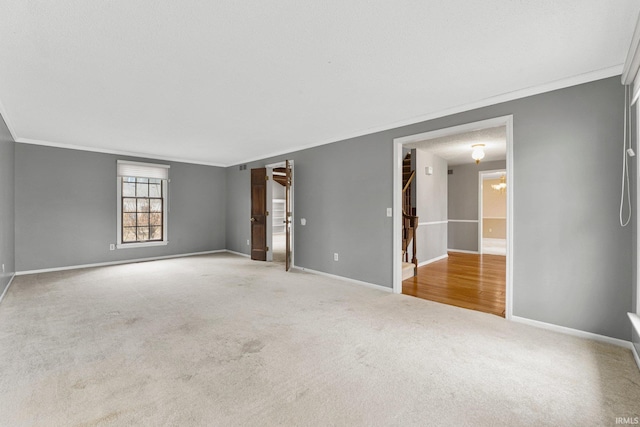 interior space with visible vents, stairway, carpet, crown molding, and baseboards