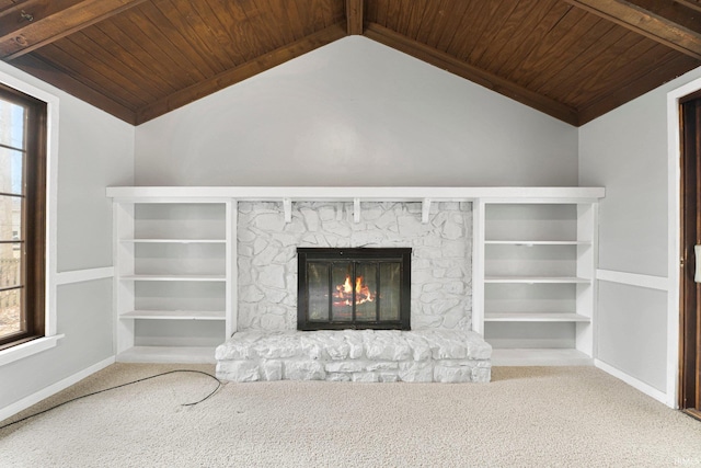 unfurnished living room with baseboards, carpet floors, vaulted ceiling with beams, a fireplace, and wood ceiling