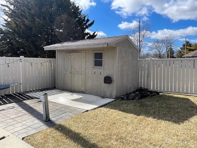 view of shed with a fenced backyard