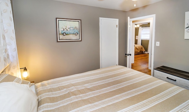 bedroom featuring wood finished floors