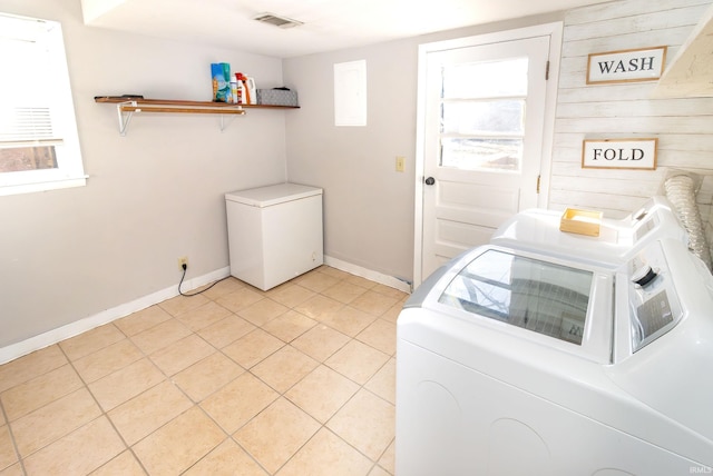 laundry room featuring a wealth of natural light, visible vents, laundry area, and separate washer and dryer