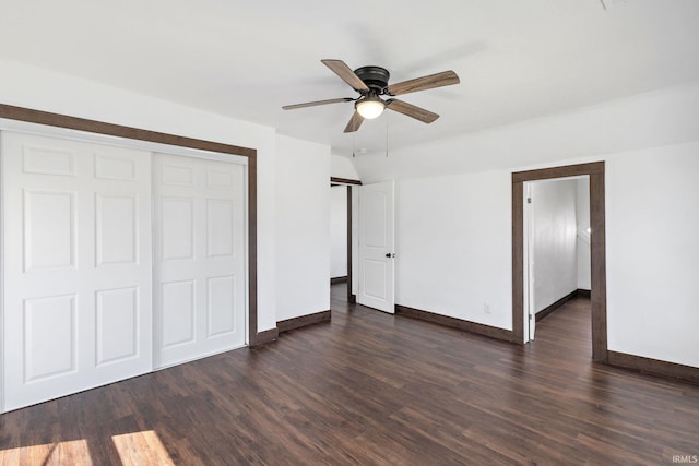 unfurnished bedroom with dark wood-style floors, baseboards, and ceiling fan