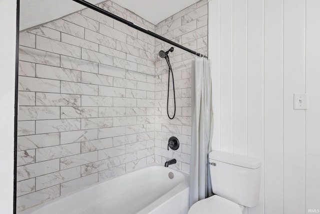 bathroom featuring toilet and shower / bath combination with curtain