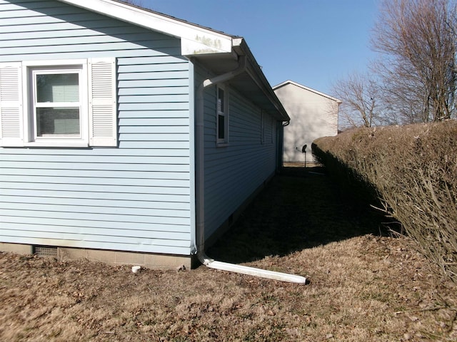 view of side of property with crawl space