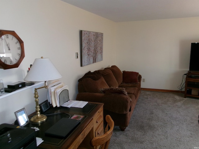 carpeted living room featuring baseboards