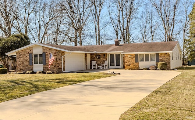 ranch-style home with brick siding, driveway, a chimney, and a garage