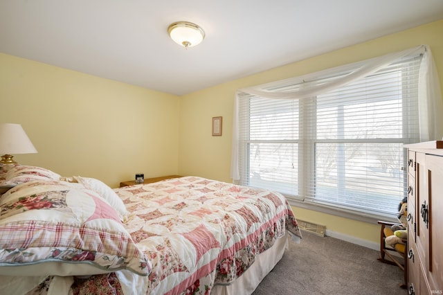 bedroom with baseboards, carpet floors, and visible vents