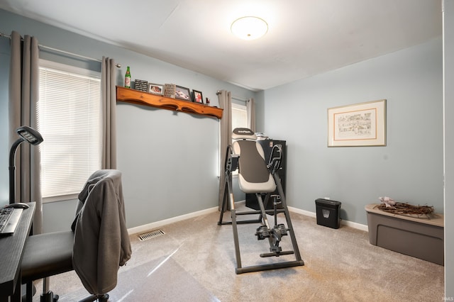 workout area with carpet, visible vents, and baseboards