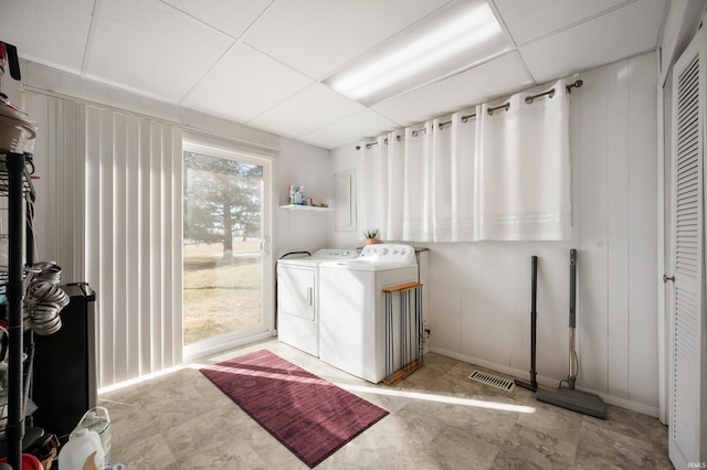 laundry room featuring visible vents, laundry area, and washer and clothes dryer