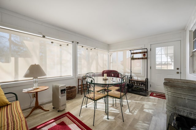 dining area with wood finished floors