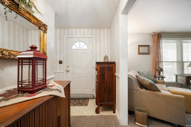 view of carpeted entrance foyer