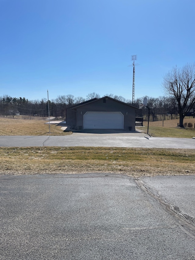 garage featuring driveway