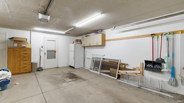 garage with a garage door opener and freestanding refrigerator