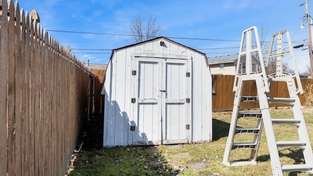 view of shed with a fenced backyard